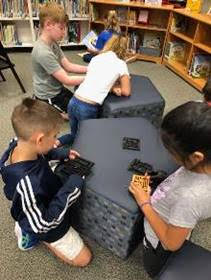 Elementary school students learning about 3d-printing
