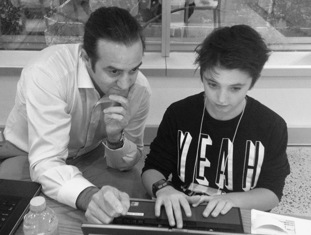  /><br />
<br />
<em>David Parkinson instructing a GE employee’s son during a session of the company’s Coding for Kids initiative.</em><br />
<br />
<strong>GEreports: Then it’s about asking questions?</strong><br />
<br />
<strong>David:&nbsp;</strong>Yes. GE sees the Industrial Internet as monitoring sets of data and having sets of models across all types of industries, and then contextualising it depending on who’s asking for that data. So if I’m a pilot, the questions I ask are: “How much fuel am I using at the moment? Have I got enough fuel to get to this next destination? Do I have to adjust my speed to slow down so that I’m burning less fuel, so that I’ve got less risk of running out of fuel on my flight?” They’re the types of questions that I would ask of that dataset.<br />
<br />
Whereas if I’m GE, or another manufacturer, I might be asking of that dataset, “How can I make this plan fly further? How is that part performing over time? Do I need to go to a new supplier or material because we’re finding failures on that same part?”<br />
<br />
Same data, same dataset, different question. But because we’re gathering all of that data and putting it in one place, we can start asking different questions depending on your use case, who you are and what context you want to put it in.<br />
<br />
<strong>GEreports: So the machines talk, and the collected conversations of those individual ‘chats’ build into something much more powerful?</strong><br />
<br />
<strong>David:&nbsp;</strong>Absolutely—that’s what’s changed. We’ve invested in&nbsp;<a href=
