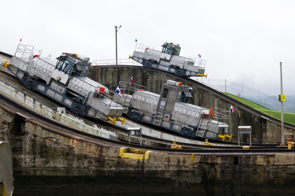 Three electric locomotives ready to help ships transit the Panama Canal
