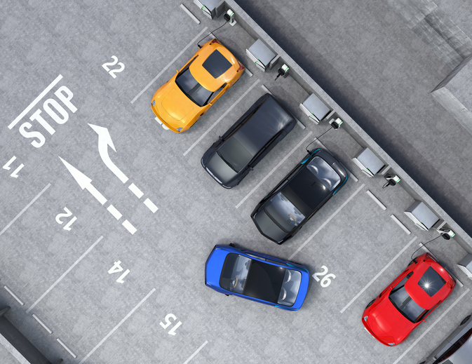 Aerial view of parking lot. Half of parking lot available for EV charging service. 3D rendering image.