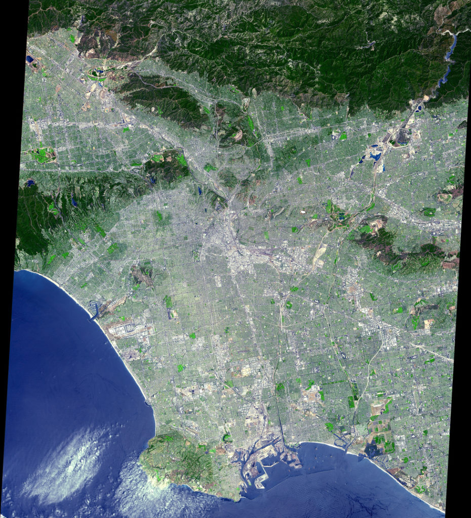 "The data were processed to create a simulated natural color image. From its start as a sleepy Spanish pueblo in 1781, Los Angeles and its metropolitan area has grown to become an ethnically diverse, semitropical megalopolis, laying claim as the principal center of the western United States and the nation's second largest urban area. The city's economy is based on international trade, aerospace, agriculture, tourism, and filmmaking. Los Angeles provides a glimpse of the typically cosmopolitan and global city of the future."