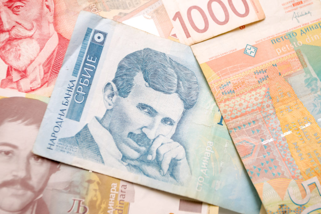 Nikola Tesla 100 dinar bill in the pile of Serbian dinars bills