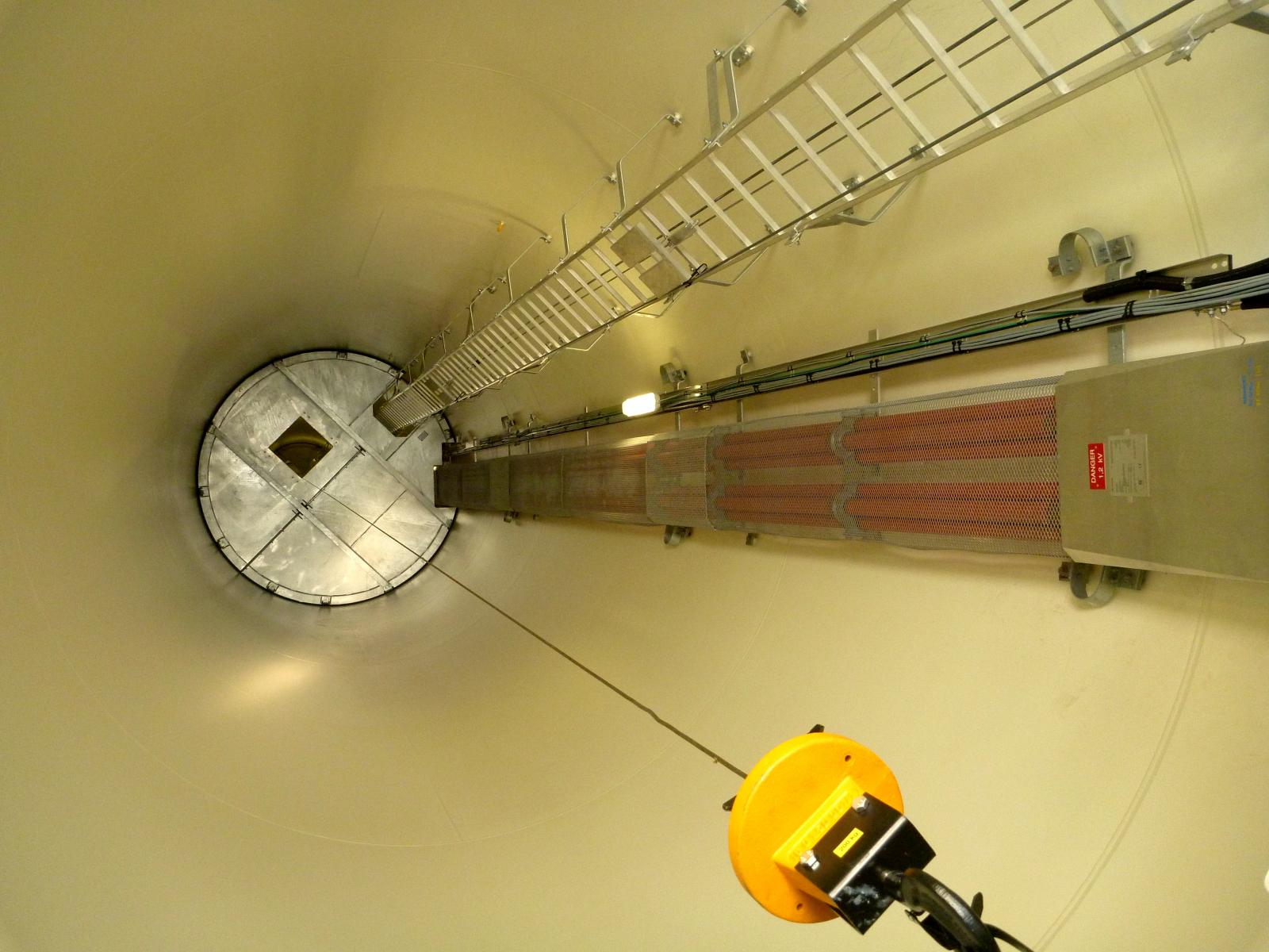 /><br />
<br />
<em>Open Day visitors got to step inside the tower of WTG No. 45 (climbing up the steep silver ladder was forbidden, a restriction for which most were grateful). </em><br />
<br />
Also taking bus tours is recent graduate Sophy Hart (a Bachelor of Science with five majors, including ecology and environmental management), a Cooma local who was thrilled to score her first real job at Boco, working for construction partner Downer as a site administrator. One of her tasks was to check the habitat surrounding each hard-stand—a turbine’s 300-tonne steel-and-concrete home base—to make sure it wasn’t home to endangered species such as the grasslands earless dragon and striped legless lizards — no new ground was broken between their November and January breeding season. Sophy’s on-the-job highlight: “I got to climb a tower. It was fantastic to go up and out the top and see the view.”<br />
<br />
Nancy and Andrew Groves also have a view on the turbines. They live with their five children on a small property on Bungarby Road, where Nancy will next year be homeschooling three of her kids. “From our house right along the ridge, we can see about 20 wind turbines,” says Nancy. “I don’t have a problem with it.”<br />
<br />
For Bella Cay and her friends, the gleaming white towers are also part of their daily landscape. “We see them when we catch the bus to school,” she says. “The southern towers are on the neighbouring farm,” adds Bella’s father Oliver, a sheep farmer. He says that when he mentioned to Bella that Boco Rock was having an open day, she said, “That's where we'll have my birthday party!’” Bella explains that her mother, Jane, “wanted me to invite a million people over for my birthday … this is so much better!” Having gobbled their cake and licked their fingers, the kids prepare to head off to tour a turbine.<br />
<br />
<em>Gallery slideshow (from first photo): Matthew Groves, 2, one of the many children at the open day; landowner Bill Garnock, a big wind-farm fan; Ivana Groves, 10, who will be learning more about renewable energy from her homeschooling mum, Nancy (background); an open-day bus tour loads up; visitors on the hardstand of WTG No. 45 for a look inside a turbine tower.</em>