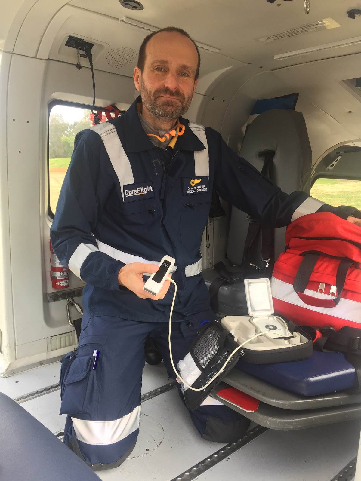 /><br />
<br />
<em>Dr Alan Garner, OAM, medical director of CareFlight, removes the Vscan dual-probe portable ultrasound from his backpack aboard the Kawasaki BK117 helicopter, which provides CareFlight’s Emergency Rapid Response Trauma Service from its Westmead base. Image courtesy CareFlight.</em><br />
<br />
“And this is small enough to stick in your pocket!” says Garner, holding Vscan in the palm of his hand. Weight matters, too, not only because CareFlight choppers and jets have to travel light—balancing the need for crew and fuel, with medical-equipment and patient load. It’s mostly because the response team carries critical equipment on their backs, from the aircraft to the patient. And in most urban situations, the CareFlight emergency physician continues critical care in an ambulance on the way to the hospital—so critical equipment has to be carried with them.<br />
<br />
In the urban emergency environment, CareFlight’s role is more about “delivering team to patient than about putting the patient in an aircraft”, says Garner. Starting effective treatment as soon as possible at the scene of the injury improves patient outcomes, so flying in as close to an accident scene as possible typically delivers help ahead of an ambulance battling traffic, but once assessed and stabilised, the patient is then usually within 15 minutes’ drive of hospital care. CareFlight’s specialised emergency physician offers continuous care, whatever the means of transport.<br />
<br />
One of CareFlight’s four Vscans is used in the Northern Territory, where the service’s helicopters and jets provide regional care and transport of patients much more quickly than would be possible by any other means, sometimes from oil or gas rigs such as the massive INPEX Ichthys LNG project 220km off the north coast of Australia, sometimes from holiday destinations or cruise ports in countries such as Vanuatu and Fiji. With Vscan in their top pocket, physicians can constantly, efficiently monitor patients’ conditions. “I couldn’t describe it as anything other than lifesaving, because of the ability to intervene immediately to fix the right problem,” says Garner.