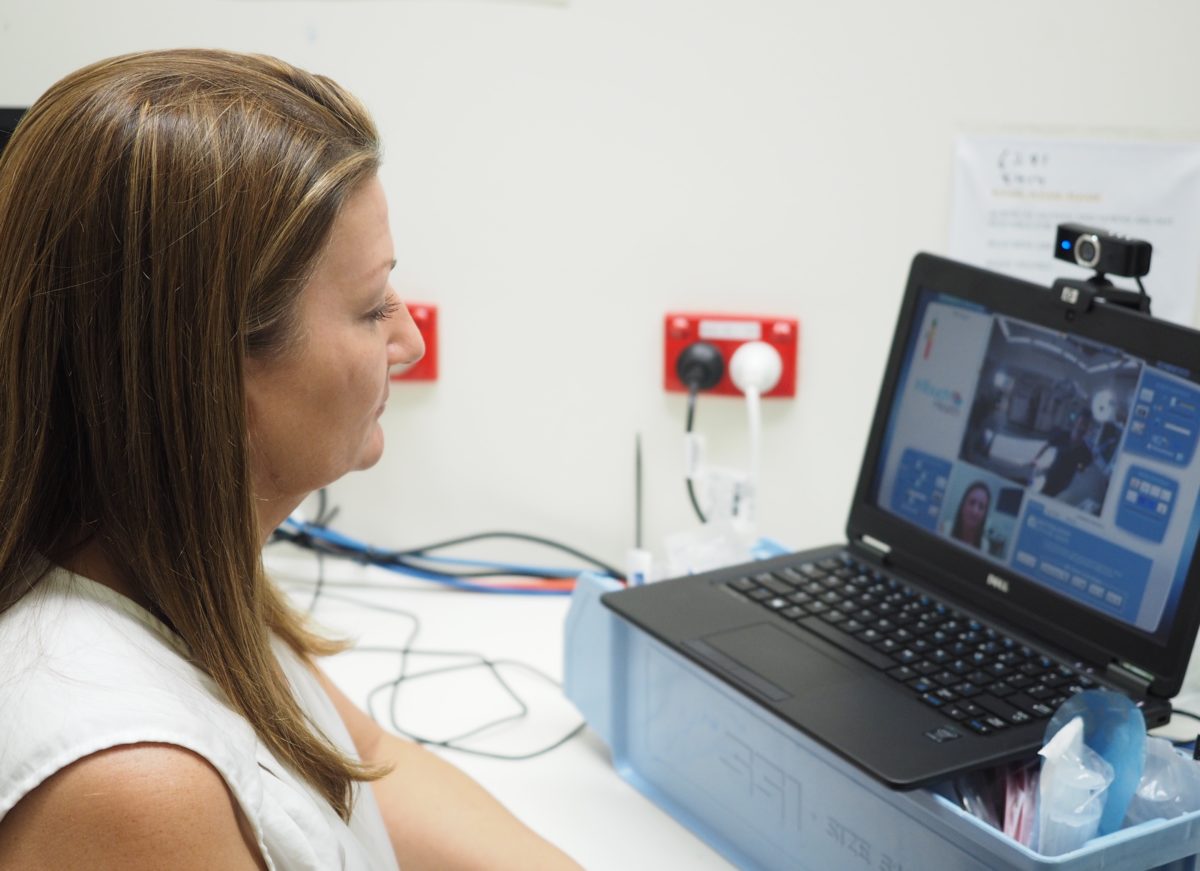 Donna Stibbard, GE Healthcare's education leader for Australia and New Zealand, delivers virtual onsite training remotely from her laptop to the operating theatre of Tasmania's Royal Hobart Hospital. Her dashboard offers a view of the operating theatre, which can be zoomed in to the tiniest detail. She can direct a laser beam on the in-theatre robot to point to aspects of GE technology she wants to draw trainees' attention to. She can also display educational information to the robot screen in the theatre.