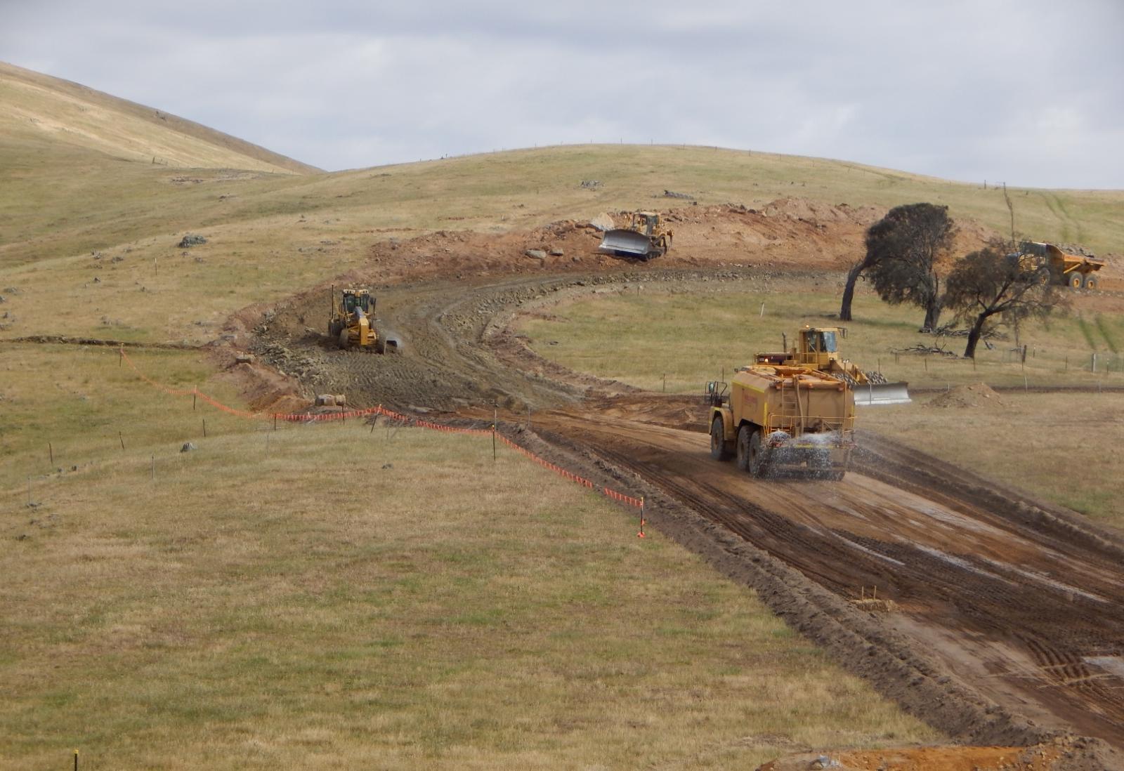  /><br />
<br />
The foothills are alive! Millers’ diggers and dozers have begun carving cuttings for Ararat Wind Farm turbines, and to allow 54km of gravel roads to link turbines to each other and to external roads.<br />
<blockquote>It’s wonderful to see commitment to projects in rural Victoria that enable communities&nbsp;to retain skills and remain viable and vibrant.</blockquote><br />
Millers is charged with constructing these access tracks to bear the cement trucks that will pour the massive concrete footing (also dug by Millers) to anchor each tower, the long-load lorries that deliver the turbines in pieces, the cranes that will help assemble them and finally the maintenance crews that will facilitate optimal performance of the turbines over their foreseen 25-year lifespan.<br />
<br />
Already well into its contract, Millers will ultimately have some 30 plant operators, and seven engineering staff and diesel fitters on the wind farm site for around eight months. Some workers have been employed from Ararat, and all who are directly involved in the project will live in town, some just during the week if their families live elsewhere, others full-time. Says Jay Miller, company director, “Ararat Wind Farm is a major project for Millers and offers us the ability to maintain employment of skilled regional staff while demonstrating our construction abilities.”<br />
<br />
Millers owns virtually all the equipment here—graders, excavators, scrapers, rollers—and must keep it in motion year on year, to ensure it continues to pay for itself. Constantly demonstrating capability is what keeps the work coming in, and this requires experienced machine operators—that is, it needs trained people to stay local.<br />
<br />
“We continually see the loss or migration of skills to capital cities,” says Miller. “It’s wonderful to see commitment to projects in rural Victoria that enable us to retain skills and enable communities to remain viable and vibrant.”<br />
<h3>Rocking the road-base requirement</h3><br />
<h4><a href=
