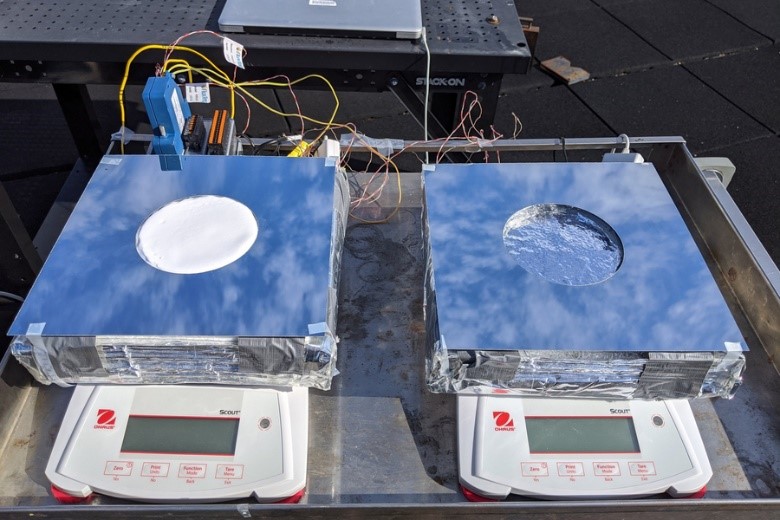 Two samples of passive cooling devices were tested on the roof of MIT's Building 1. Left: a sample of the new system, combining evaporative cooling, radiative cooling, and insulation. Right: a device using just evaporative cooling, for comparison testing. Credit: Zhengmao Lu.