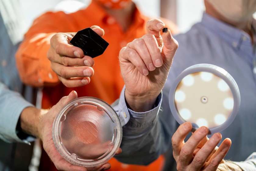 Hands holding components of the bacteria test