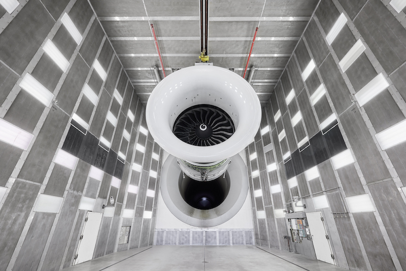 A GE90 engine in the GE Aerospace test facility at Peebles, Ohio. Top: On August 22, the GE Aerospace crew in Durham, North Carolina, celebrated the delivery of the milestone 3,000th engine.