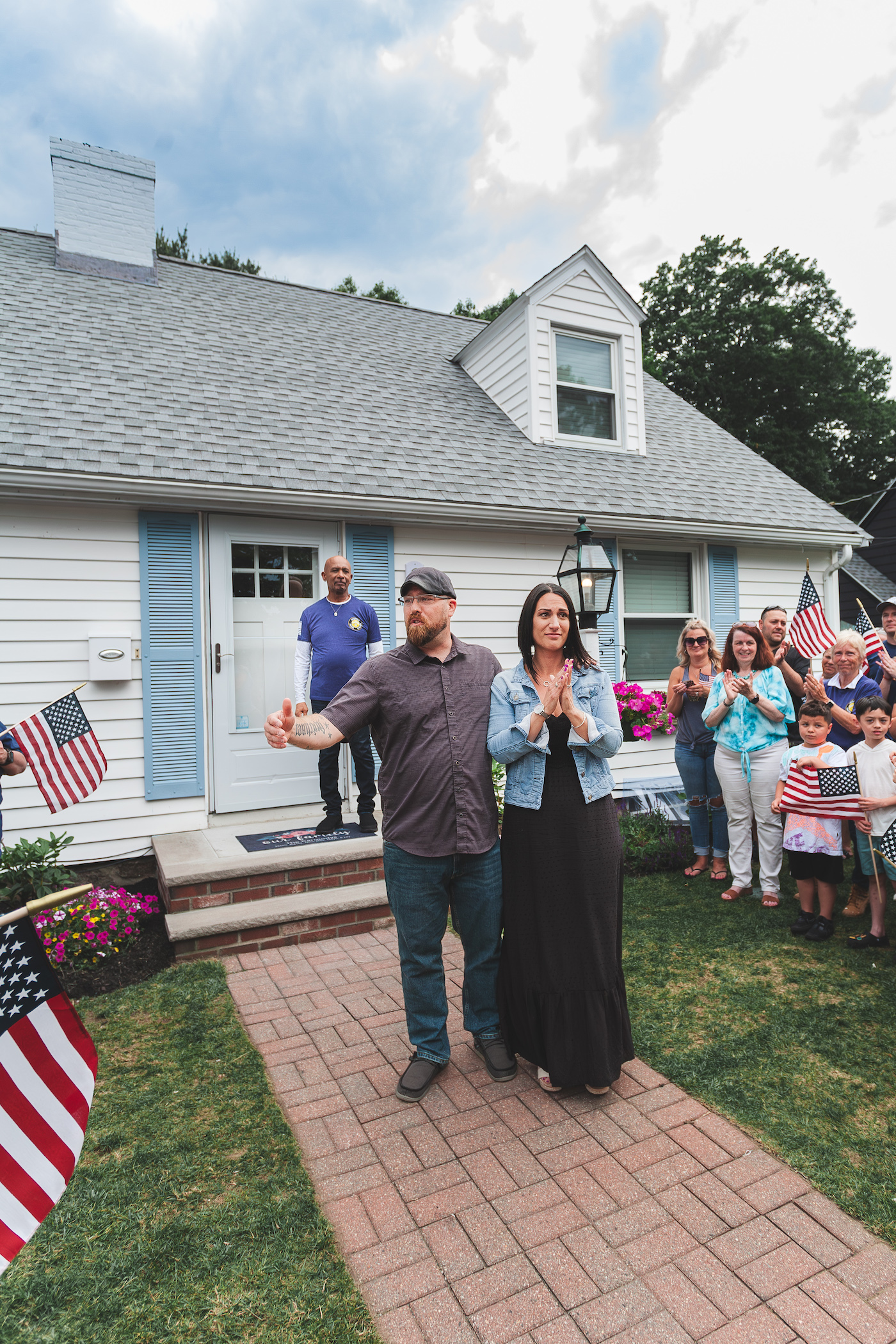 Carmody family standing in front of their home