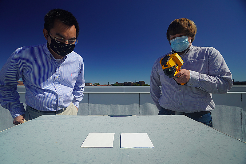 Two researchers with paint samples